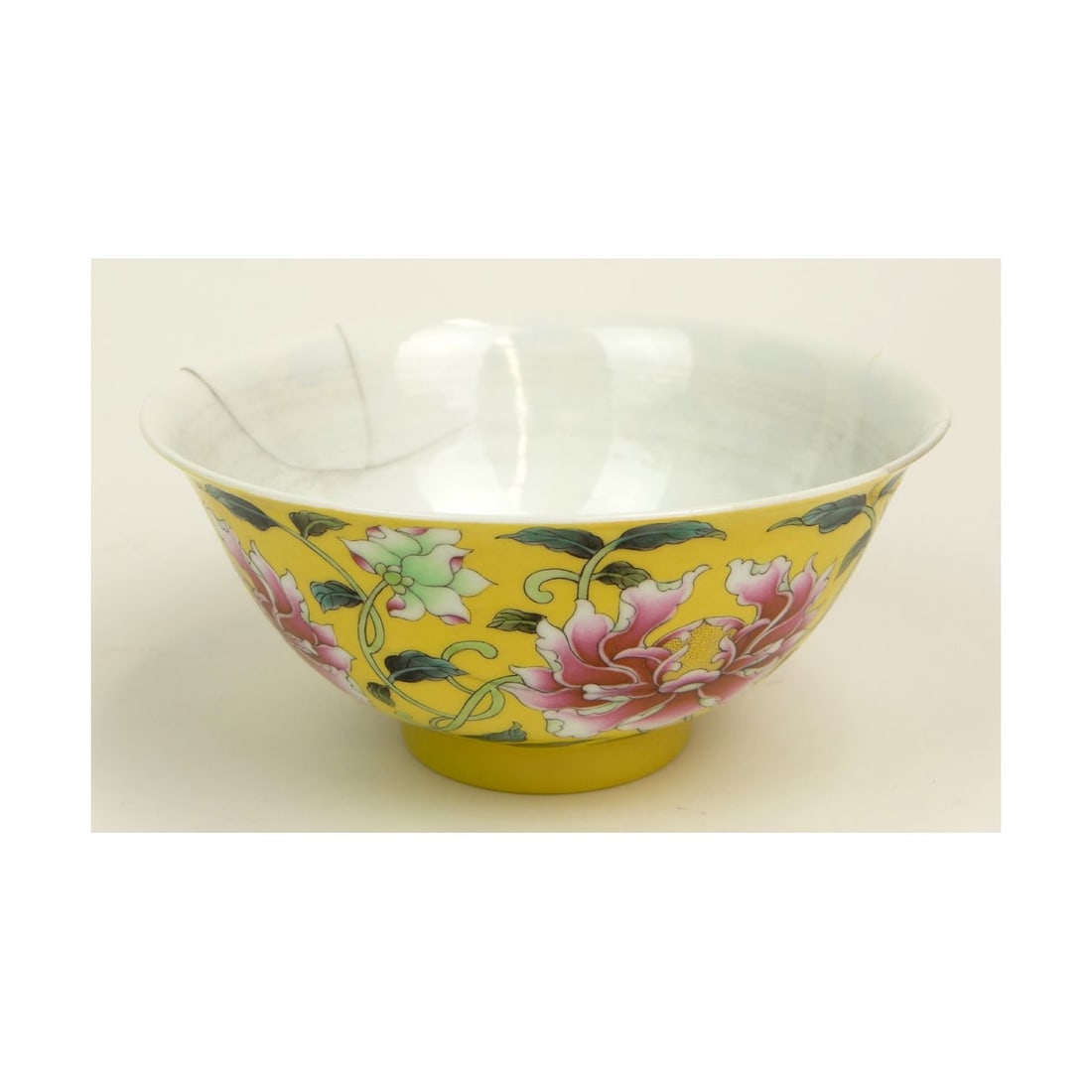 Chinese Yellow Famille Rose Bowl: Chinese Yellow Ground Famille Rose Peony Bowl. Bears the Yongsheng Character Mark to Base. Measures 3 Inches tall and 6-1/2 Inches Diameter. Kodner Galleries offers phone and absentee bidding at a
