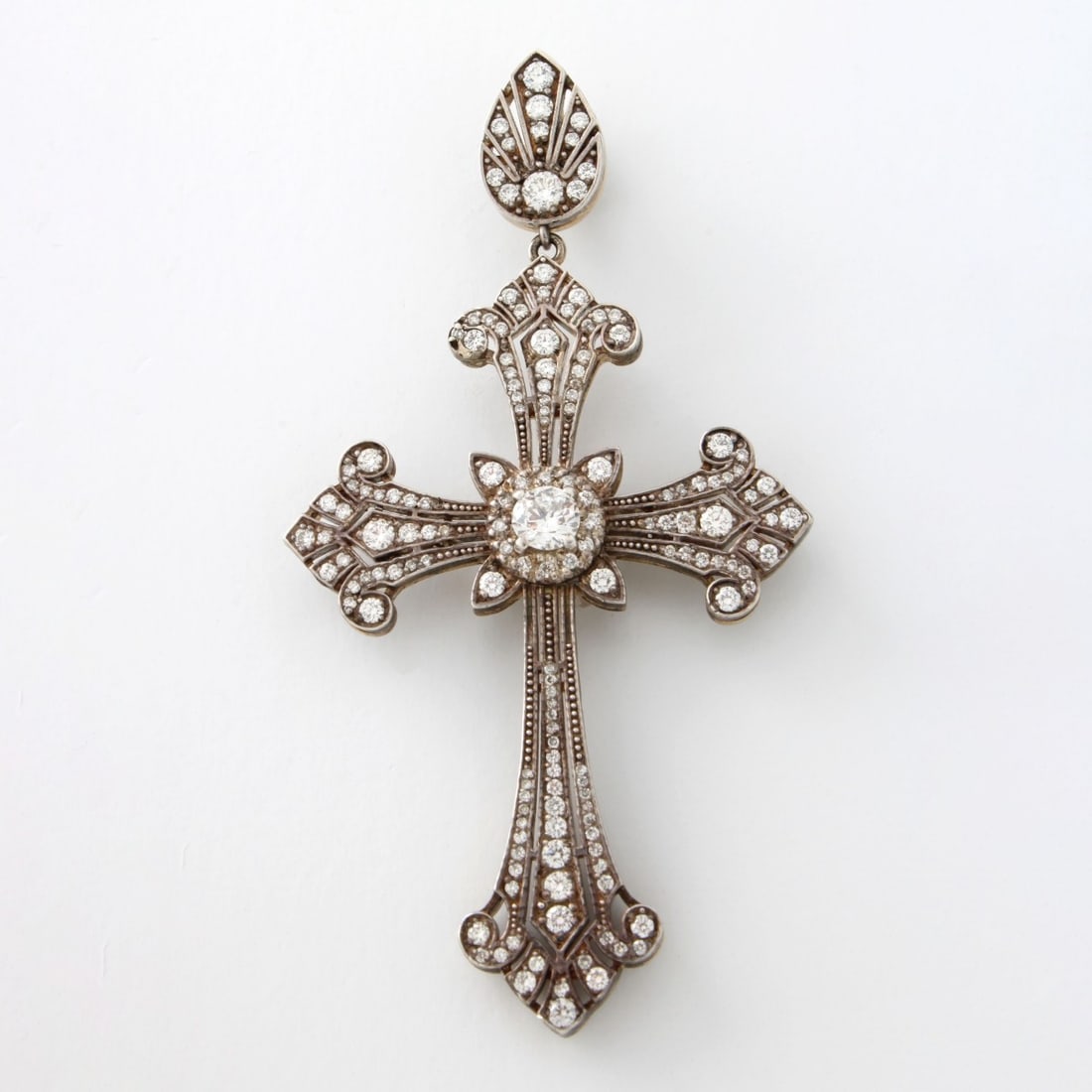 Diamond Platinum and 18K Cross Pendant: Vintage Approx. 2.75 Carat TW Round Brilliant Cut Diamond, Platinum and 18 Karat Yellow Gold Cross Pendant. Set in the center with an approx. .45 carat diamond, Diamonds G-H color, VS-SI clarity. Meas