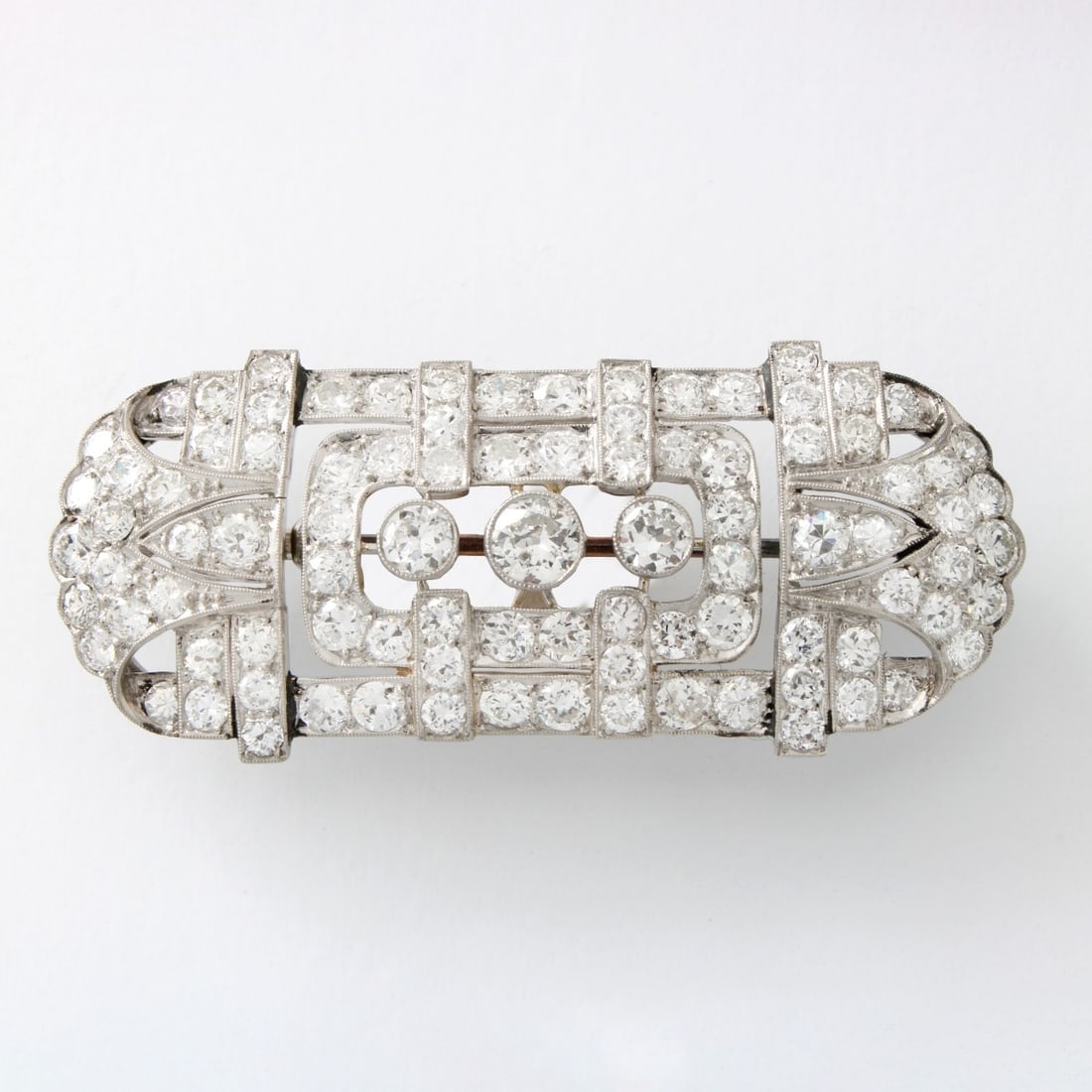Diamond and Platinum Brooch: Fine Art Deco Approx. 7.25 Carat TW Round Brilliant Cut Diamond and Platinum Bar Brooch. Diamonds F-G color, VS-SI clarity. Measures 7/8" x 2-1/8". Approx. weight: 14.0 grams. Kodner Galleries offers 
