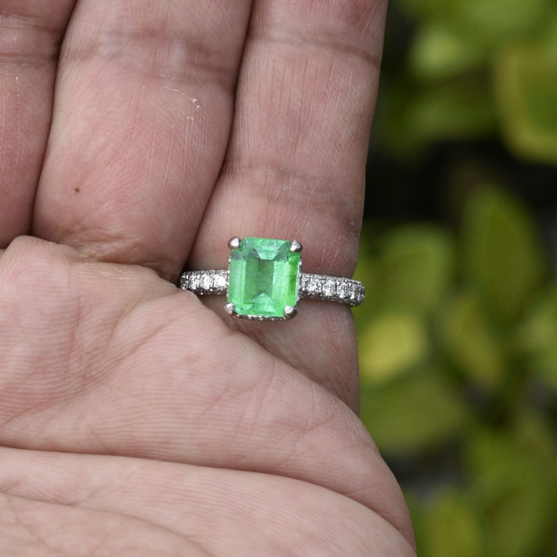 Emerald, Diamond and Platinum Ring: Approx. 1.54 Carat Colombian Emerald and Platinum Ring Accented with Numerous Small Round Brilliant Cut Diamonds. Emerald with vivid color. Stamped Plat. Ring size 4-3/4. Approx. weight: 5.31 grams. K