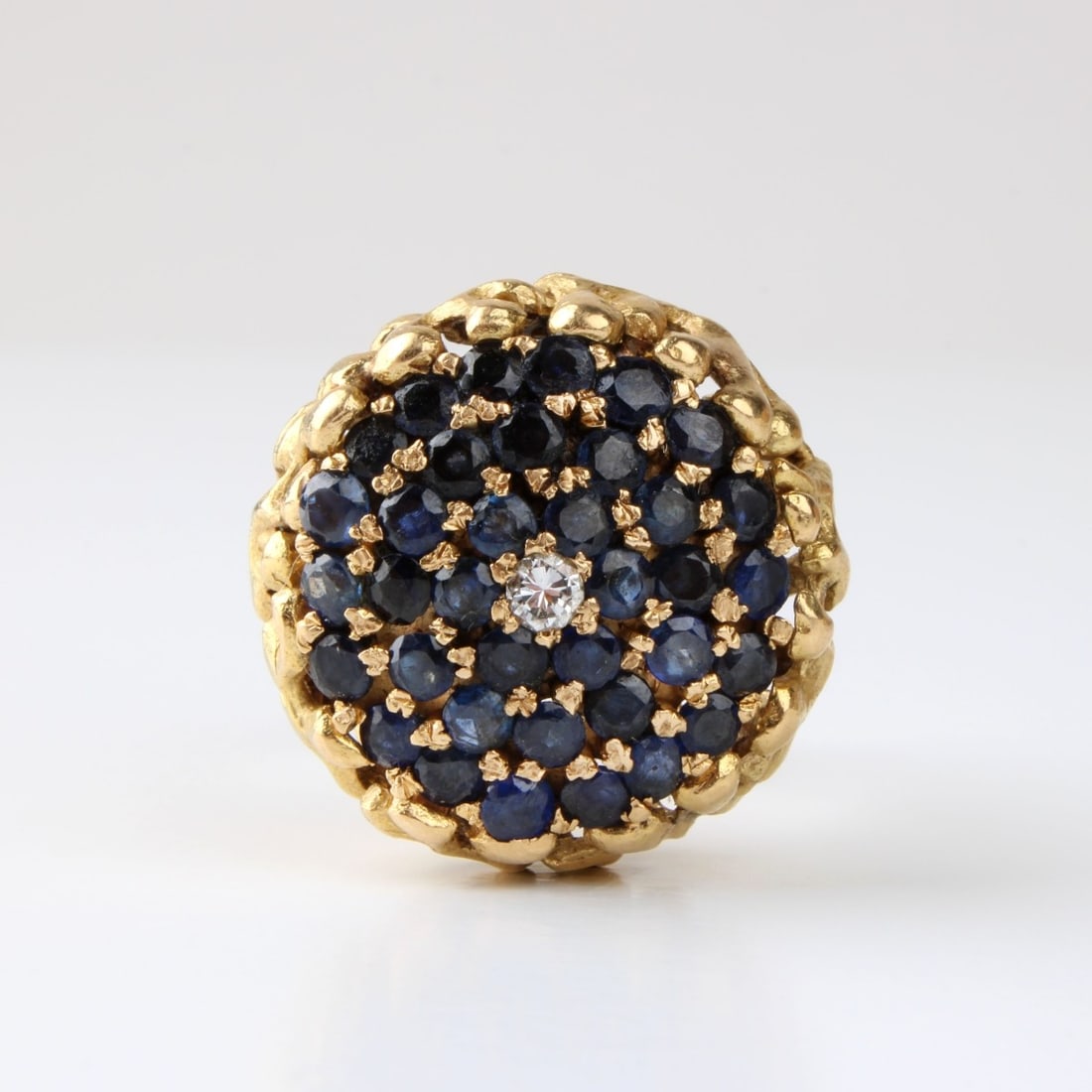 Sapphire, Diamond and 18K Ring: Vintage Approx. 4.0 Carat TW Gem Quality Round Cut Sapphire, .12 Carat Round Brilliant Cut Diamond and Heavy 18 Karat Yellow Gold Cocktail Ring. Sapphires with vivid color. Ring size 8. Approx. weight
