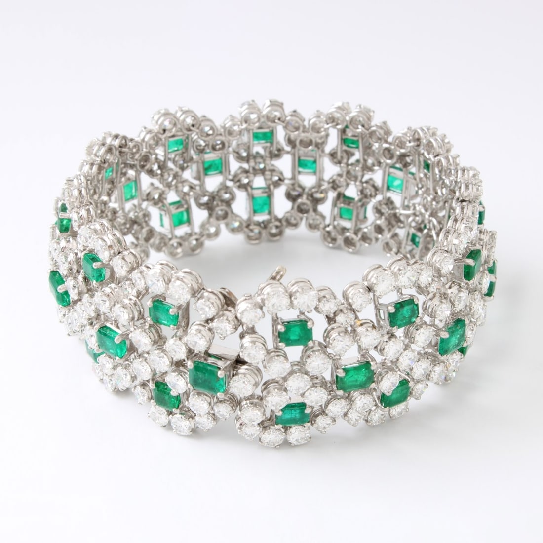 Emerald, Diamond & Plat. Bracelet: Very Fine Vintage Approx. 18.0 Carat TW Thirty-six Octagonal Step Cut Colombian Emerald, 46.0 Carat TW Two Hundred Thirty Round Brilliant Cut Diamond and Platinum Wide Flexible Link Bracelet.