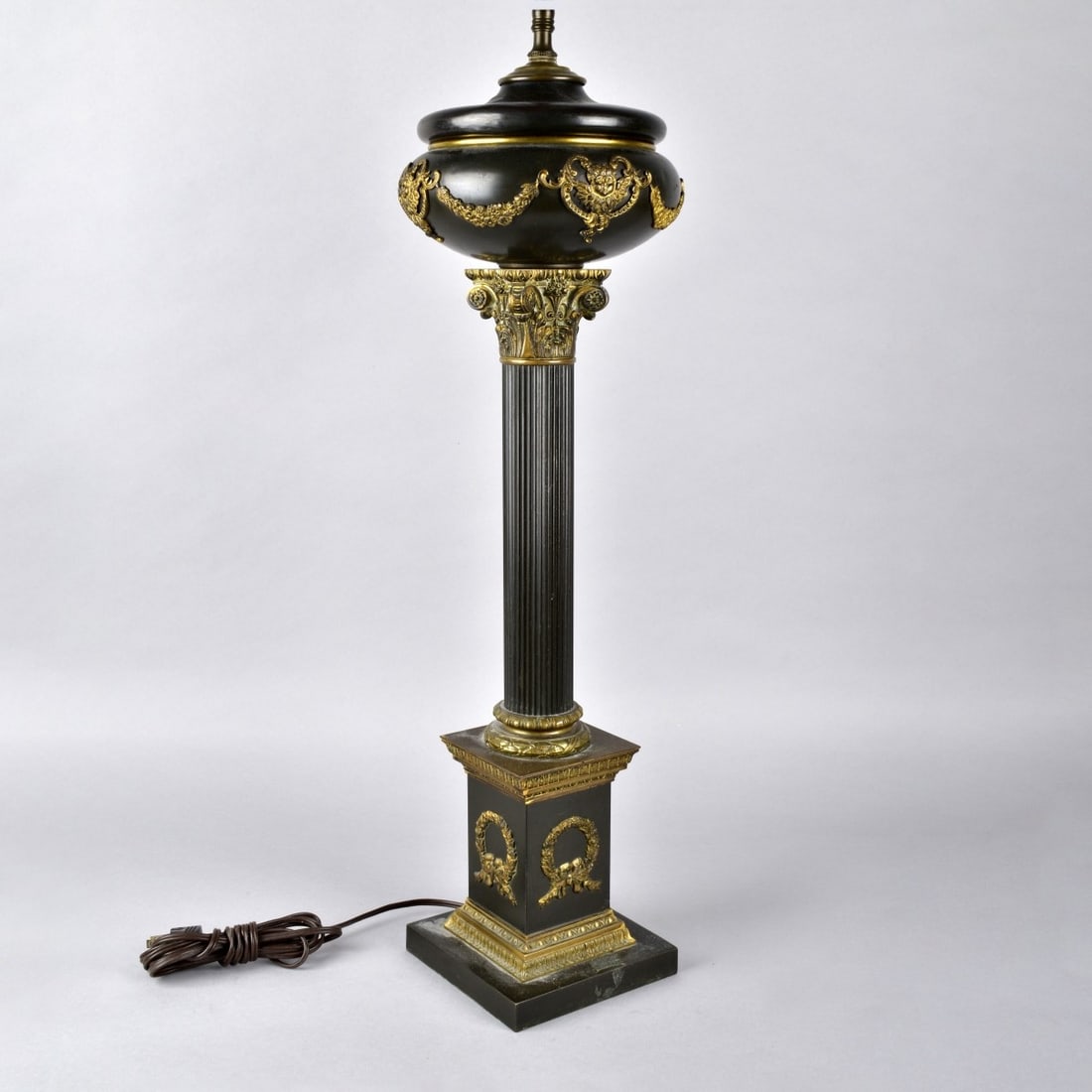 French Empire Style Parcel Gilt and Black White Me: Vintage French Empire Style Parcel Gilt and Black White Metal Lamp. Measures 37-1/4" x 7-3/4". Kodner Galleries offers phone and absentee bidding at a low, flat 21% buyer?s premium without surcharge