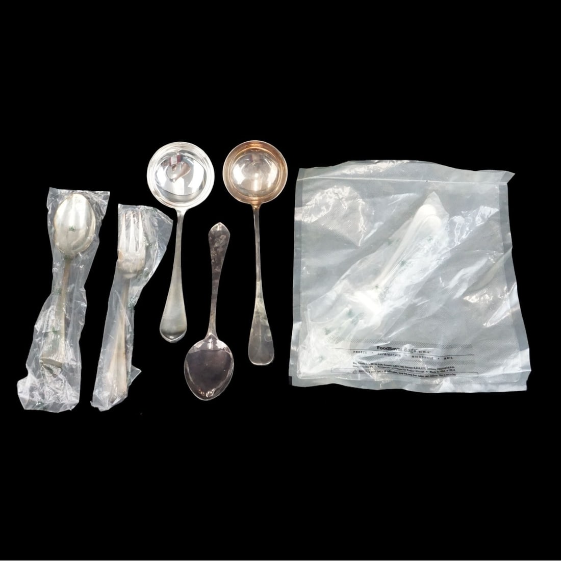 7 Vintage French Silver Serving Pieces: Lot of Seven (7) Vintage French Silverplate Tableware to Include Two Serving Ladle, Meat Fork, Two Serving Spoons, and a 2-Piece Fish Serving Set. All appropriately hallmarked. Largest ladle measures 