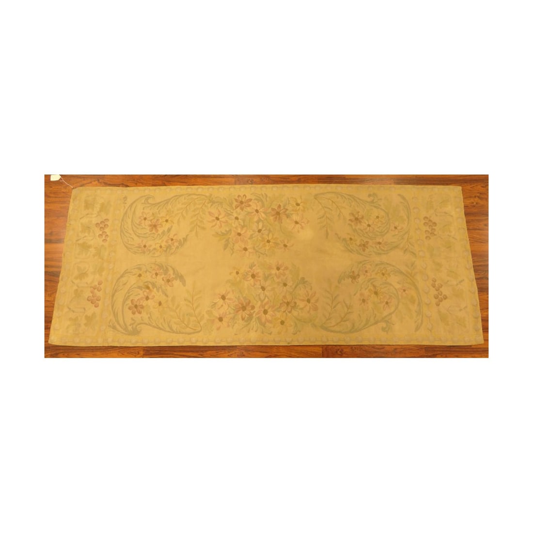 Aubusson Tapestry: 19/20th Century Aubusson Tapestry. Unsigned. Floral patterns on surface. Measures 44" x 100". Kodner Galleries offers phone and absentee bidding at a low, flat 21% buyer?s premium without surcharge