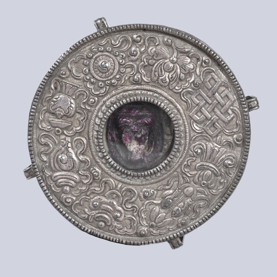 Antique Tibetan Manuscript / Amulet Box: Antique Tibetan Repousse Silver Tone Manuscript / Amulet Box. Unmarked. Measures 1-1/4" x 4-3/8". Kodner Galleries offers phone and absentee bidding at a low, flat 21% buyer?s premium without surcharg