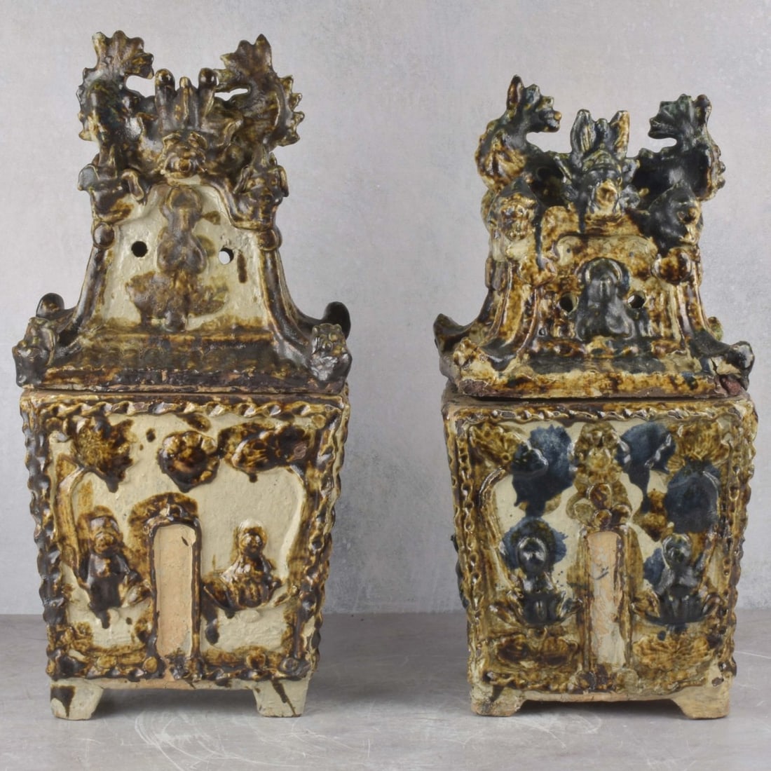 Japanese Burial Urns: Pair of Okinawan Folk Art Pottery Pagoda Design Burial Jar (Ossuary), with Canted Sides, Double Fish Form Lid Finials. Measures: 20" high, 9-1/2" wide, 7-1/2" deep. Kodner Galleries offers phone and