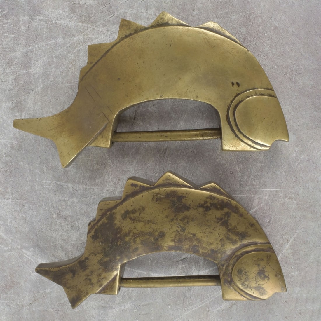 Antique Chinese Brass Locks: Two (2) Antique Chinese Brass Locks in the Form of Fish. Largest measures: 7" long, smallest measures: 6-1/4" long. Kodner Galleries offers phone and absentee bidding at a low, flat 21% buyer?s