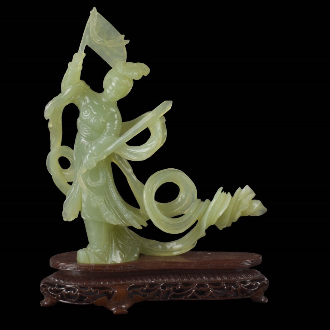 Carved Jade Chinese Quan Yin: Vintage Carved Jade Chinese Quan Yin Sculpture Holding a Flag Overhead with a Carved Wood Base. Figure measures: 8" high, 7" wide, 2" deep, base measures: 1-1/2" high. Kodner Galleries offers phone an