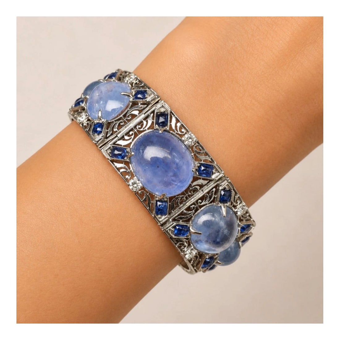 GIA Sapphire, Diamond & Plat. Bracelet: GIA Certified 110.0 Carat TW Nine (9) Oval Double Cabochon No Heat Ceylon Sapphire and Platinum Bracelet Accented with 7.0 Carat TW Sapphires and 1.35 Carat TW Diamonds. Diamonds I-K color, VS1-SI2