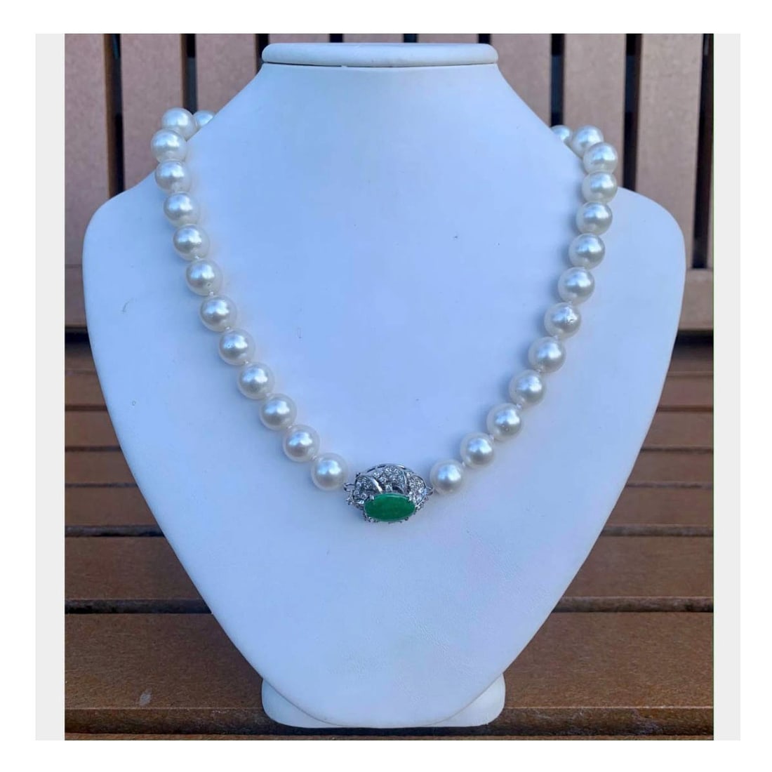 Pearl, Jade & Diamond Necklace: Vintage Single Strand 13.65-11.02 South Sea Pearl Necklace with Jade, 1.50 Carat Round Cut Diamond and 14 Karat White Gold Clasp. Pearls with good luster and polish. Diamonds G-H color, VVS1-VS1