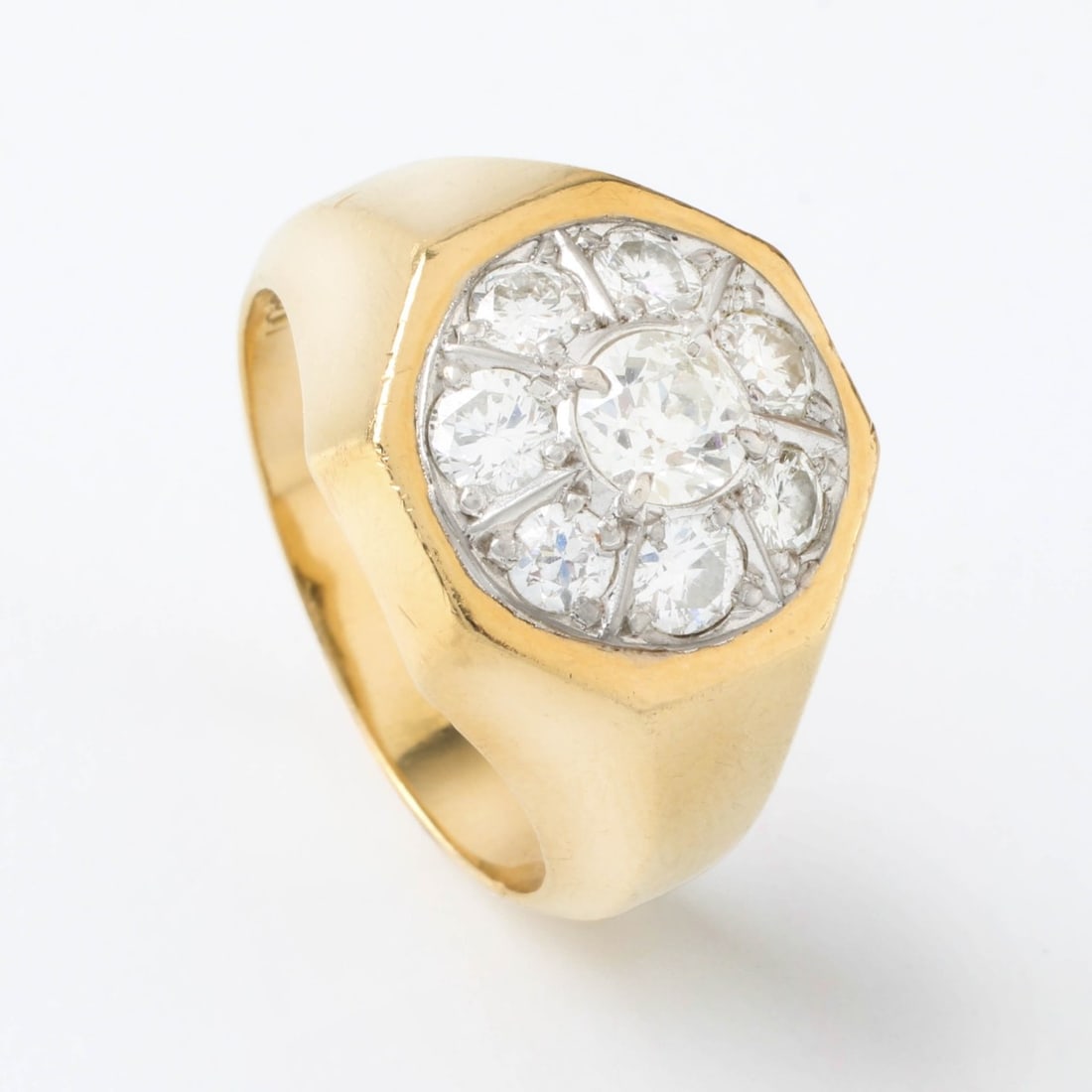 Diamond and 18K Ring: Man's Vintage Diamond and 18 Karat Yellow and White Gold Ring. Set in the center with an approx. .75 carat old European cut diamond and accented with .70 carat TW seven round brilliant cut diamond. Di