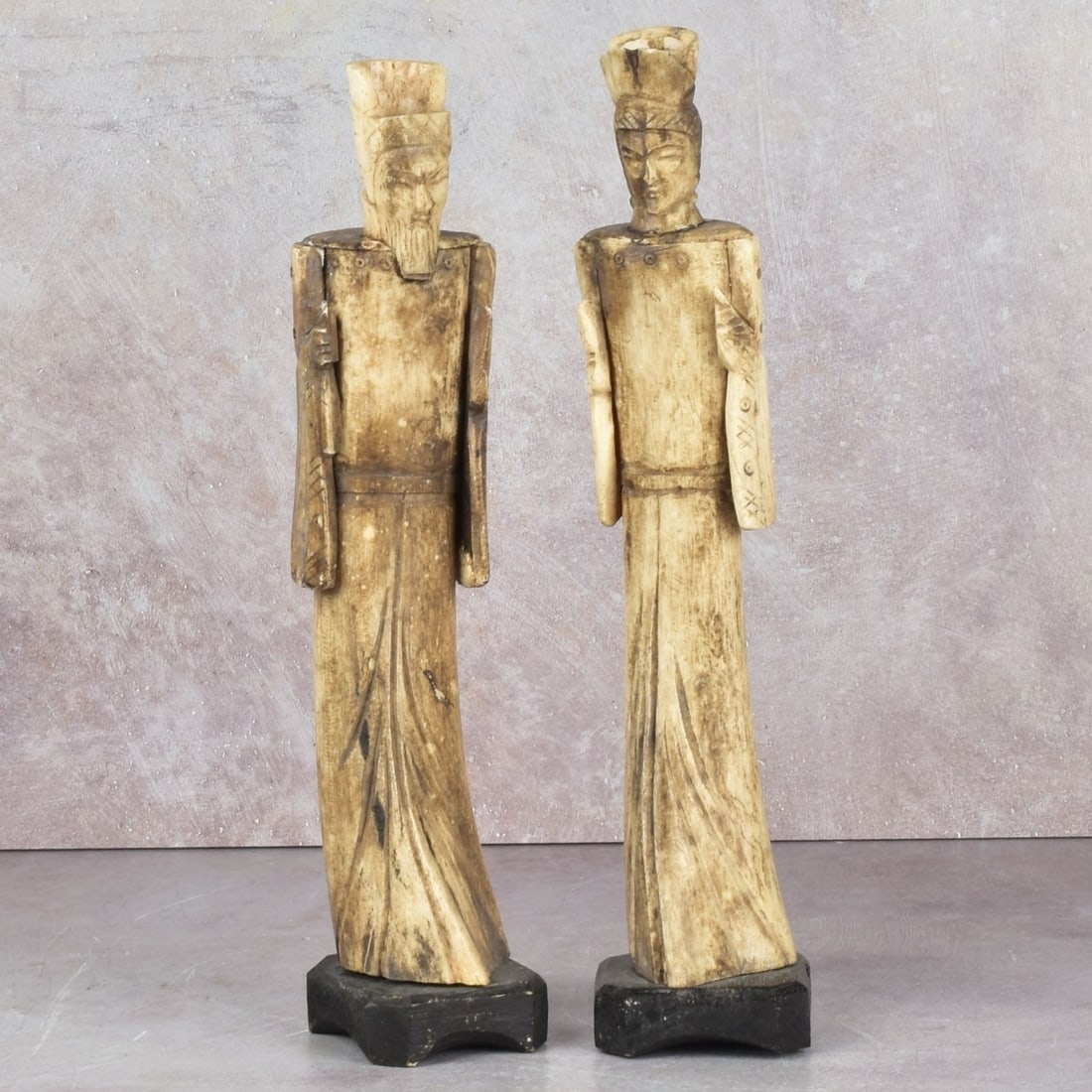Antique Carved Chinese Figures: Antique Carved Chinese Figures. Late 19th century. Signed. Figure measures: 8-3/4" high, 1-1/2" wide, 1-1/4" deep, base measures: 3/4" high. Kodner Galleries offers phone and absentee bidding at a