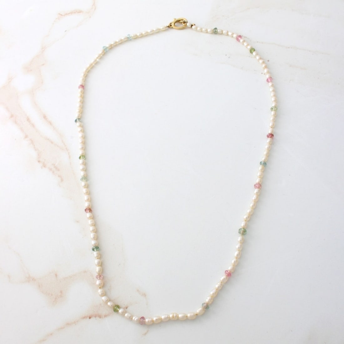 Tourmaline, Pearl and 18K Necklace: Delicate Antique 3mm Natural Pearl and Rose Cut Multi-color Tourmaline Necklace with 18 Karat Yellow Gold Clasp. Measures 16-1/2" L. Approx. weight: 6.17 grams. Kodner Galleries offers phone and