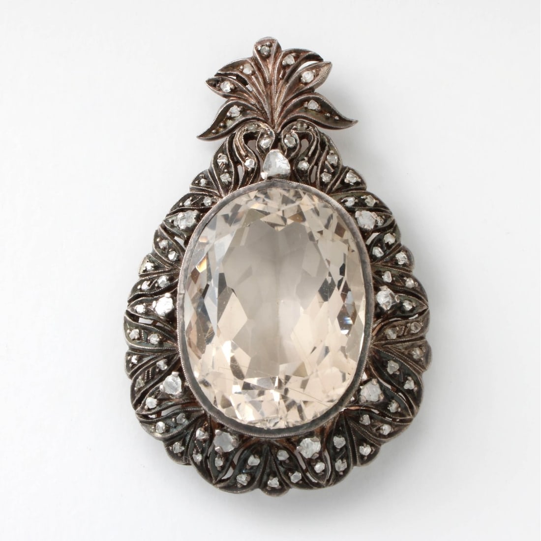 Crystal, Diamond and Silver / Vermeil Pendant: Antique 19th Century Approx 50.0 Carat Oval Cut Rock Crystal, Rose Cut Diamond and Filigree Silver / Vermeil Pendant. Measures 2" L, 1-5/16" W. Approx. weight: 20.83 grams. Kodner Galleries offers