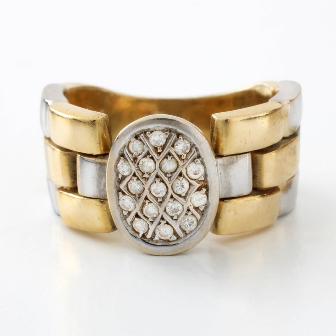 20K and Diamond Ring: Vintage 20 Karat Yellow and White Gold Flexible Link Ring Accented with Small Round Cut Diamonds. Ring size 7. Approx. weight: 10.35 grams. Kodner Galleries offers phone and absentee bidding at a