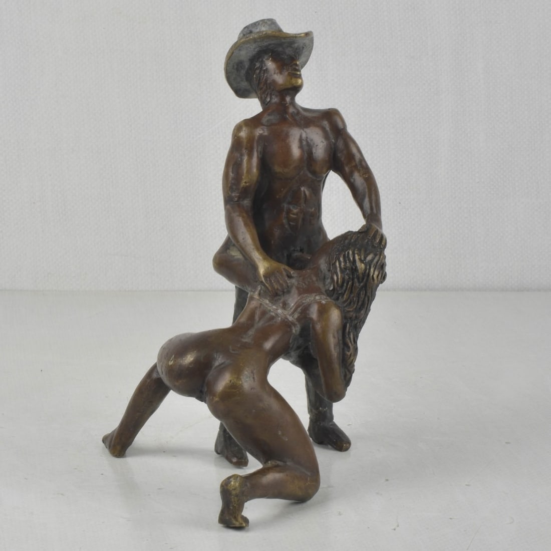 M. Nieto Erotic Bronze Sculpture: M. Nieto Erotic Bronze Sculpture Signed by M. Nieto. Measures: 9" high, 6" wide, 6" deep. Kodner Galleries offers phone and absentee bidding at a low, flat 21% buyer?s premium without surcharge or