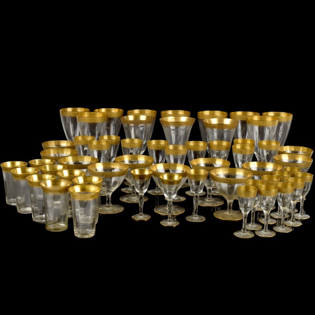 Tiffin Franciscan Crystal Stemware: Fifty-six (56) Vintage Tiffin Franciscan Crystal Stemware with Gold Encrusted Rims. Consisting of 3 red wine, measures: 6-3/4" high, 10 white wine, measures: 6-3/4" high, 9 cordials, measures: 3-3/4"