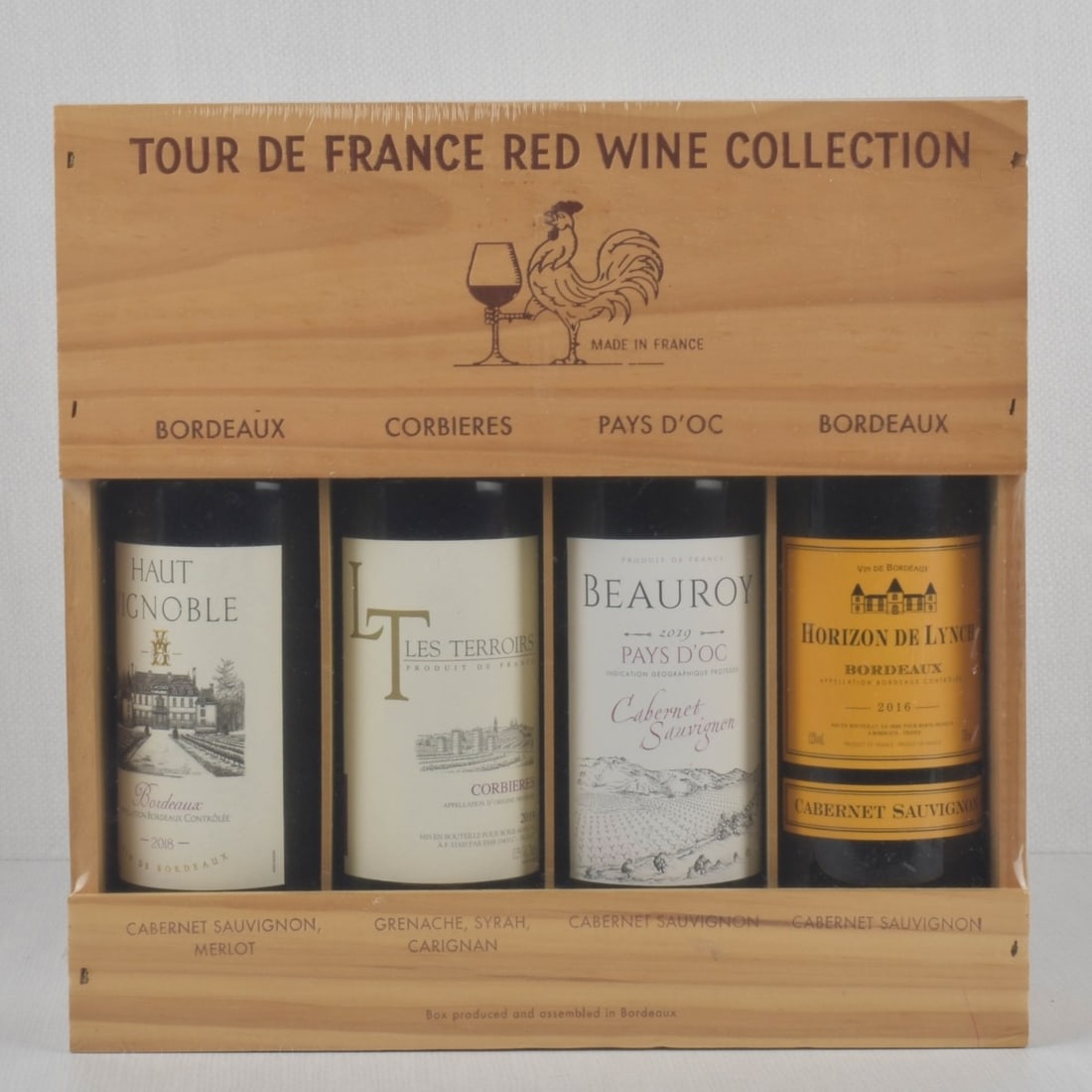 Bottles of French Wine: Four (4) Bottles of French Wine. Shrink wrapped and in small wood crate. Kodner Galleries offers phone and absentee bidding at a low, flat 21% buyer?s premium without surcharge or hidden fees. For