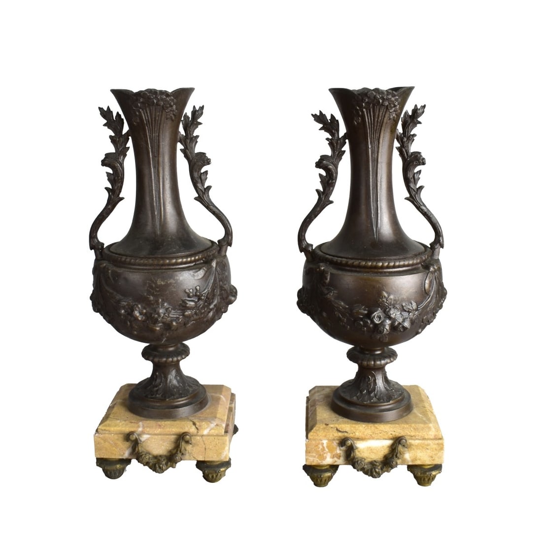 Pair of Bronze Vases on Marble Stands: Pair of Bronze Vases on Brown Marble Stands with Bronze Feet and Wreath. Measures 14-3/4" H x 5-1/2" W. Kodner Galleries offers phone and absentee bidding at a low, flat 21% buyer?s premium without