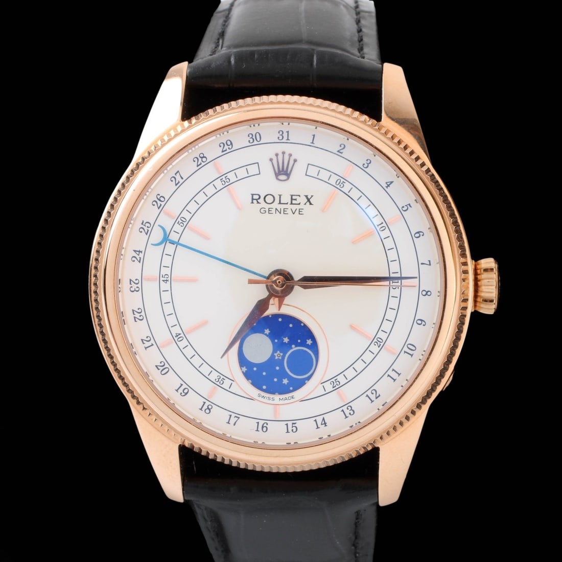 Rolex Moonphase Clone Watch: Rolex Moonphase Clone Rose Tone Stainless Steel Watch with Leather Strap Bracelet. Automatic movement. Case measures 44mm. Bracelet measures 10" L. Kodner Galleries offers phone and absentee bidding
