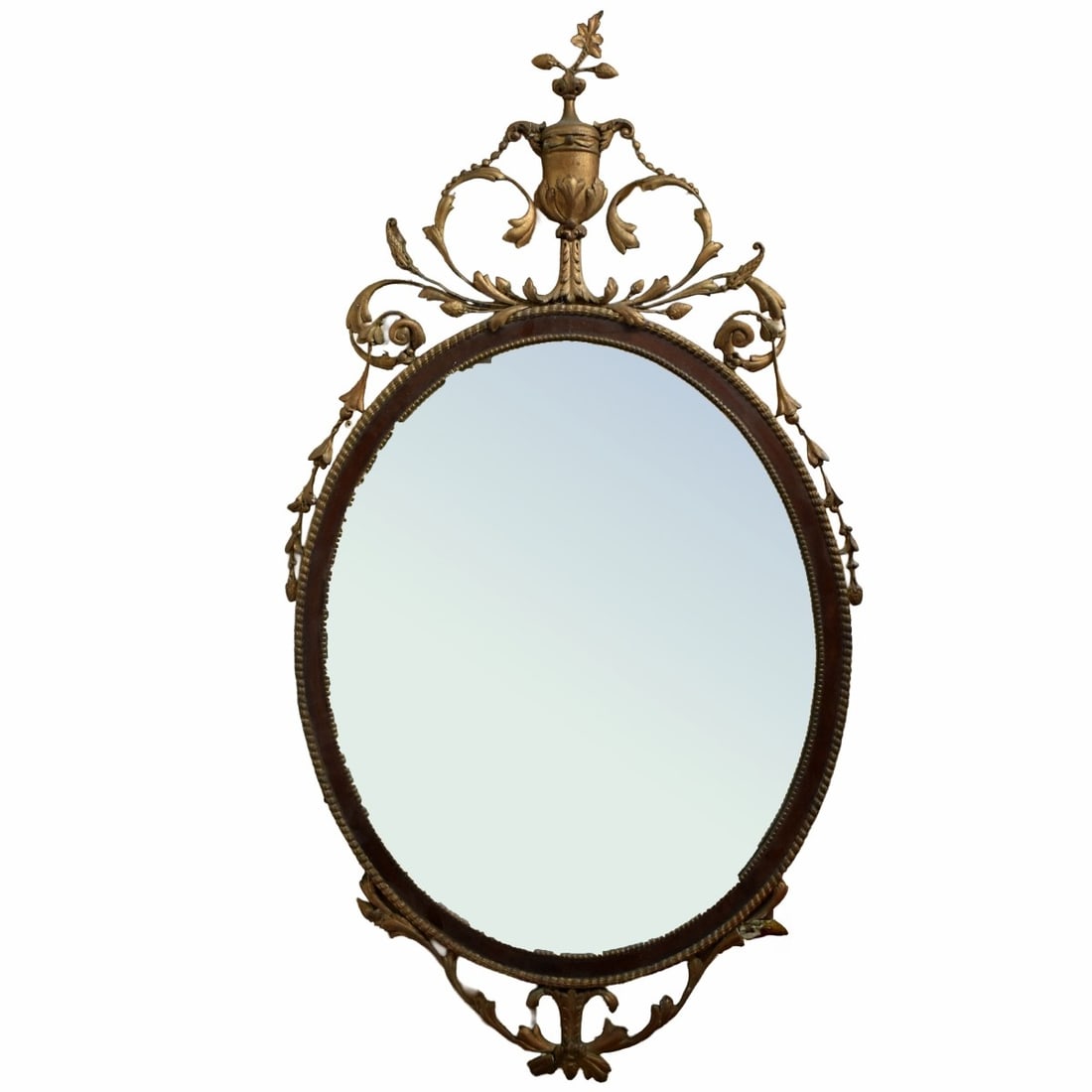 Late 19th C. French Oval Mirror: Late 19th Century French Gilt Wood and Painted Metal Oval Mirror. Decorated with scrolling flowers and an urn/vase. Measures: 52" high, 28" wide, 2-1/8" deep. Provenance: From an Important Coconut