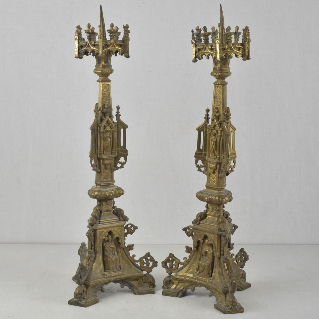 19th Century French Candlesticks: Two (2) 19th Century French Pricket Candlesticks with Cathedral-style Decoration. Measures: 22" high, 7" wide, 7" deep. Provenance: From an Important Coconut Grove, Florida Estate. Kodner Galleries