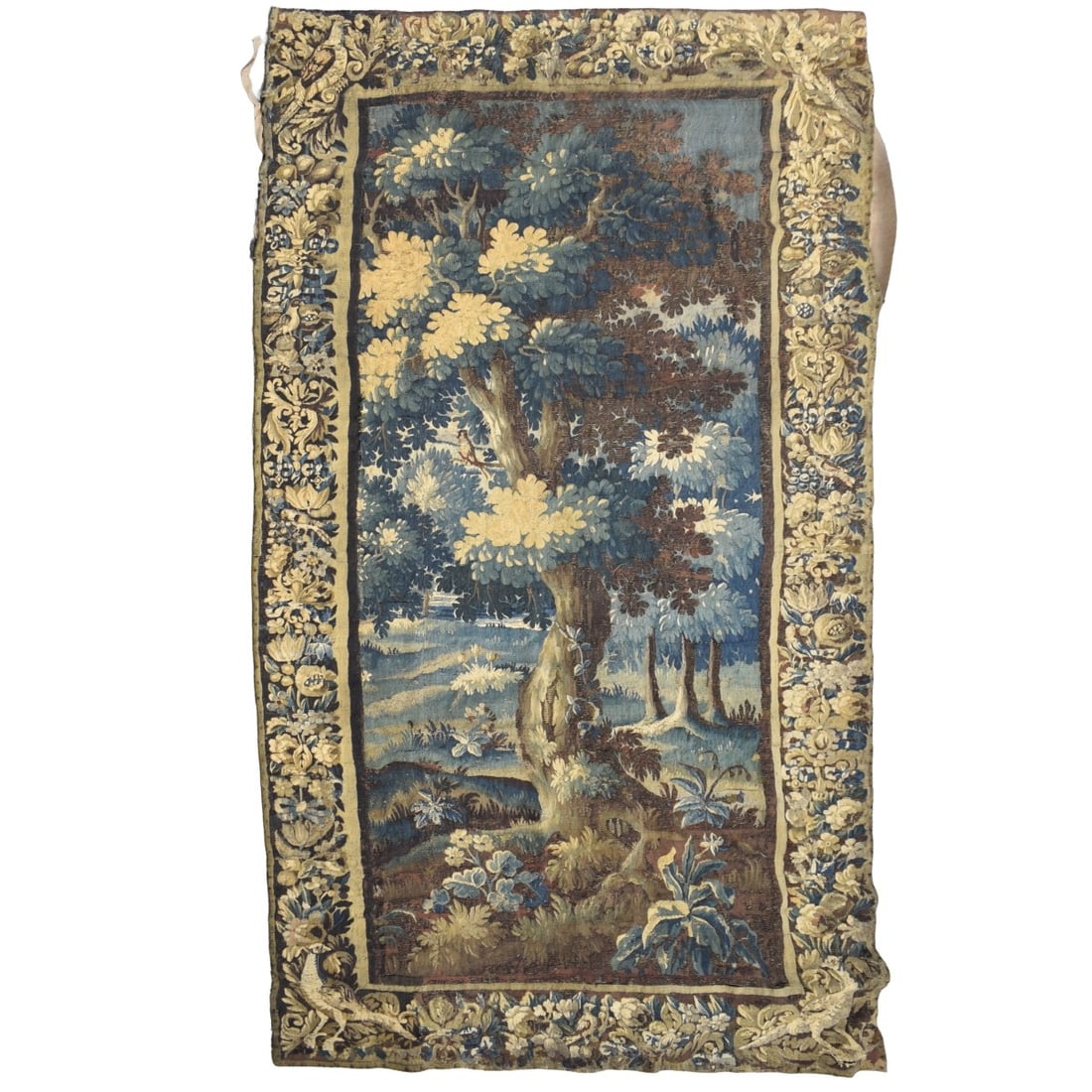 17th/18th C. Flemish Verdure Tapestry: 17th/18th Century Flemish Verdure Tapestry of a Landscape. Bordered and backed with linen. Measures: 108" high, 51" wide. Provenance: From an Important Coconut Grove, Florida Estate. Kodner Galleries