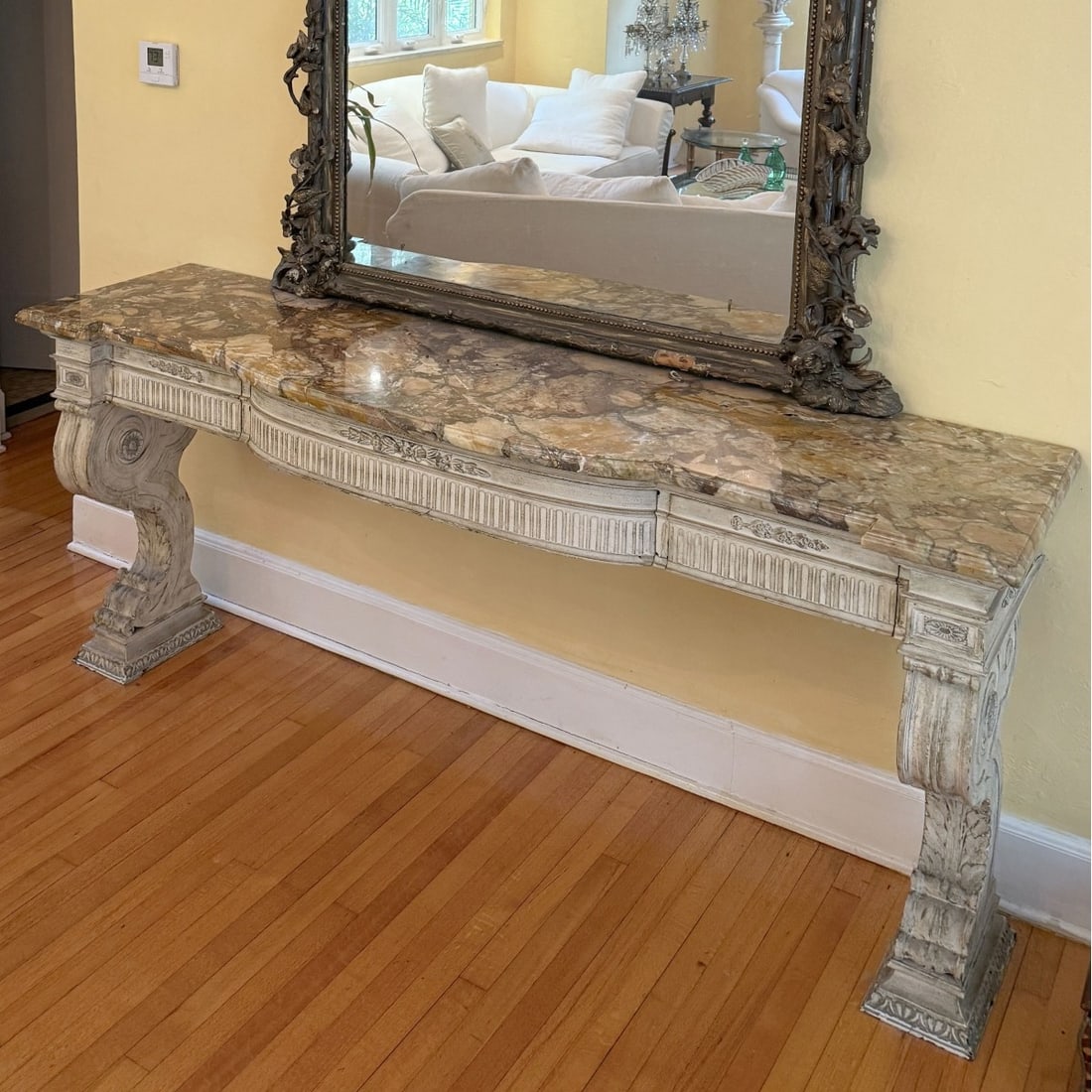Early 20th Century Italian Table: Early 20th Century Italian Marble Top and Carved Painted Wood Console Table. Measures: 38" high, 84" wide, 21-1/2" deep at widest point. Provenance: From an Important Coconut Grove, Florida Estate.