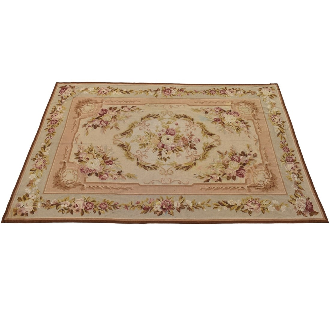 French Aubusson Woven Carpet: Semi -antique French Flat-weave Wool Abusson Carpet with an Overall Green, Rose and Tan Floral Pattern. Measures: 112" x 71-1/2". Kodner Galleries offers phone and absentee bidding at a low, flat 21%