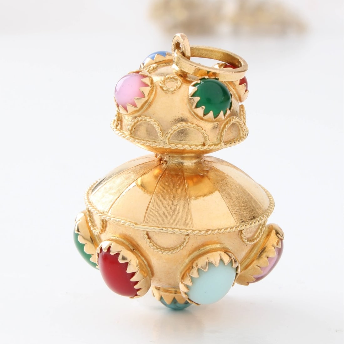 Hardstone and 18K Charm: Vintage Multi-color Hardstone and 18 Karat Yellow Gold Charm / Pendant. Stamped 18K. Measures 1" H, Approx. weight: 8.75 grams. Kodner Galleries offers phone and absentee bidding at a low, flat 21%