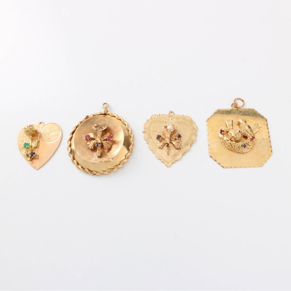14K Charms: Four (4) Vintage 14 Karat Yellow Gold Charms. Each set with a small round brilliant cut gemstone. Largest measures 3/4". Approx. total weight: 12.89 grams. Kodner Galleries offers phone and absentee