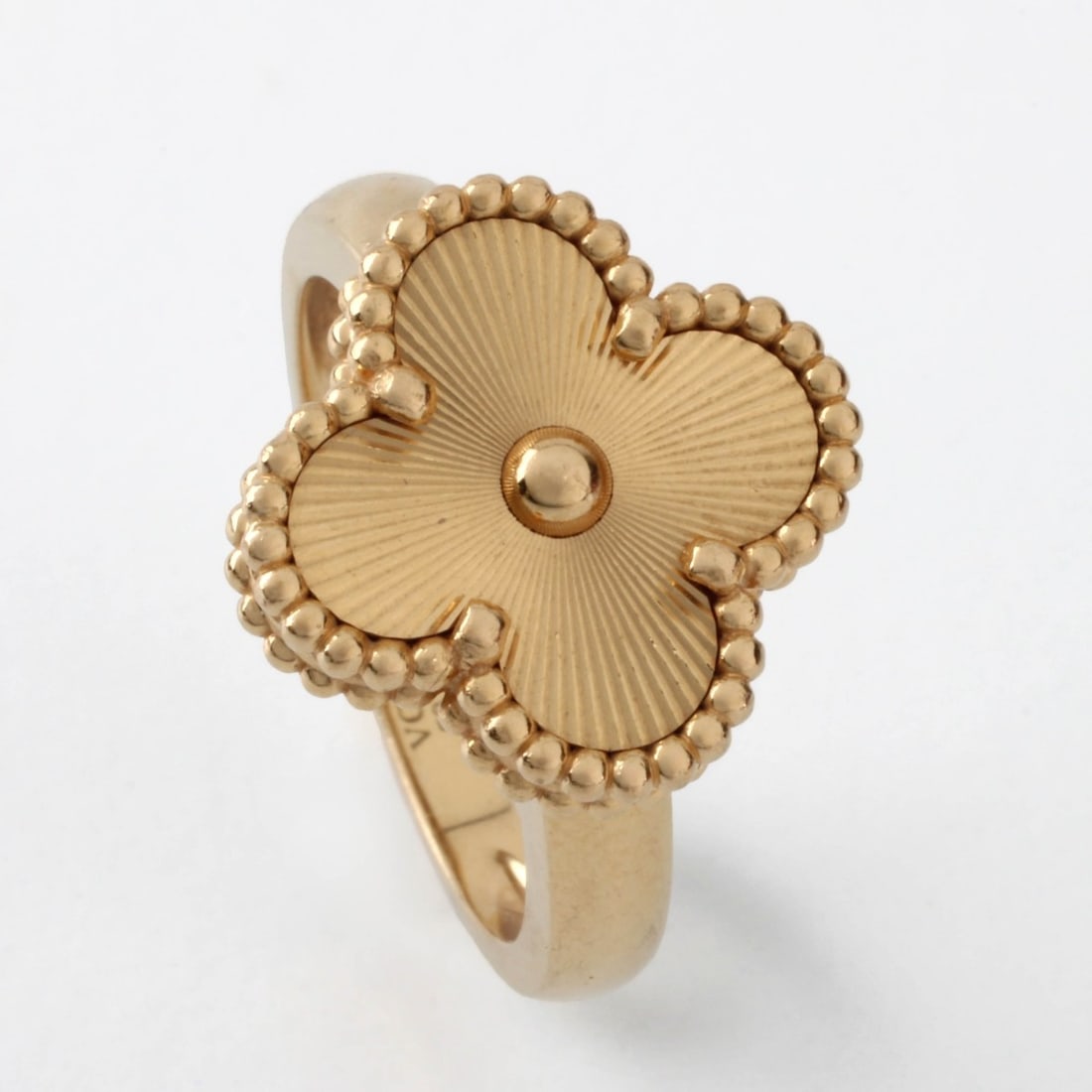 VCA 18K Alhambra Ring: Van Cleef & Arpels 18 Karat Yellow Gold Alhambra Ring. Stamped VCA Au750, numbered 53 JG132074. Ring size 5. Approx. weight: 7.56 grams. With box. Kodner Galleries offers phone and absentee bidding at