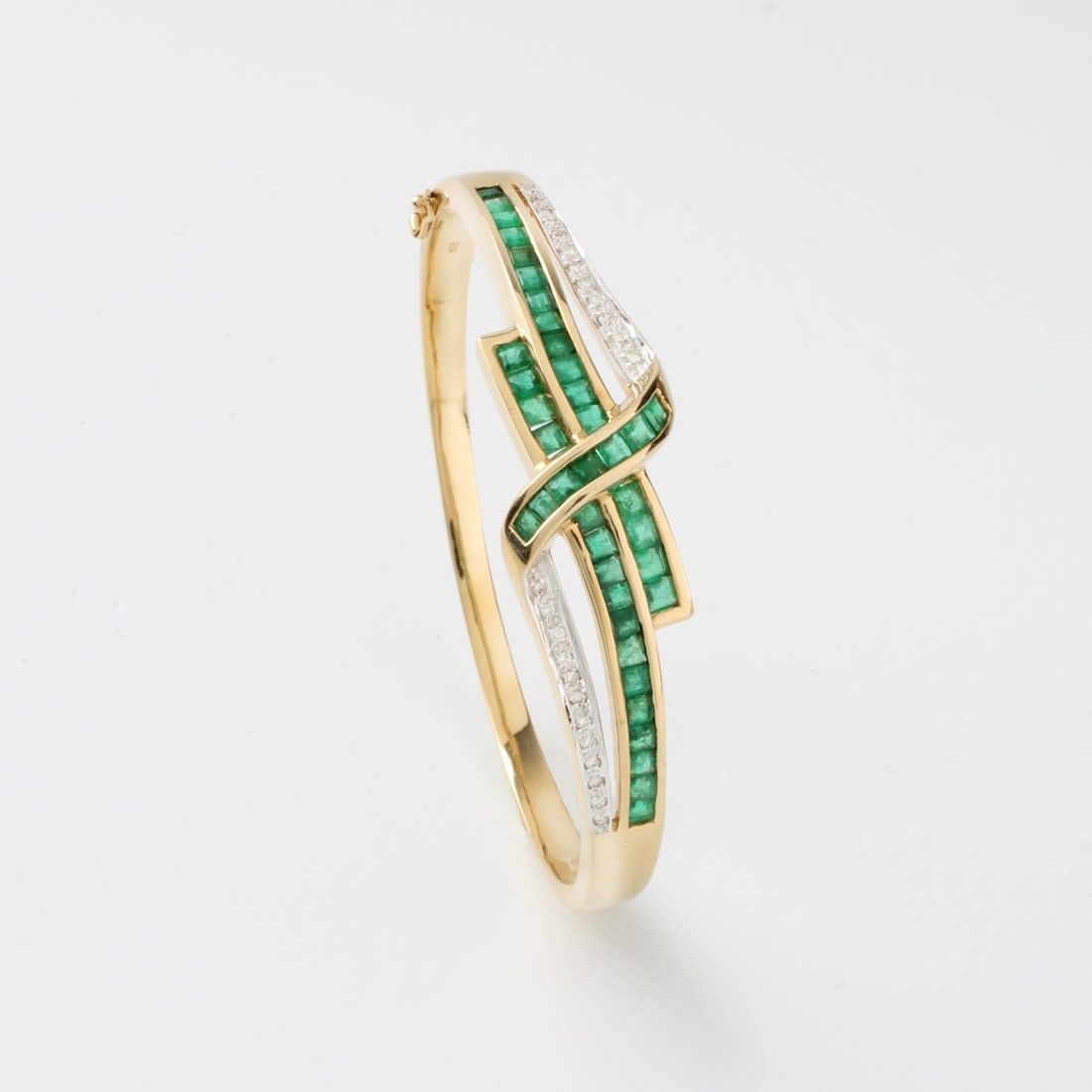 Emerald, Diamond and 14K Bracelet: 27.24 grams. Kodner Galleries offers phone and absentee bidding at a low, flat 21% buyer?s premium without surcharge or hidden fees. For information, please contact the gallery at info@kodner.com or