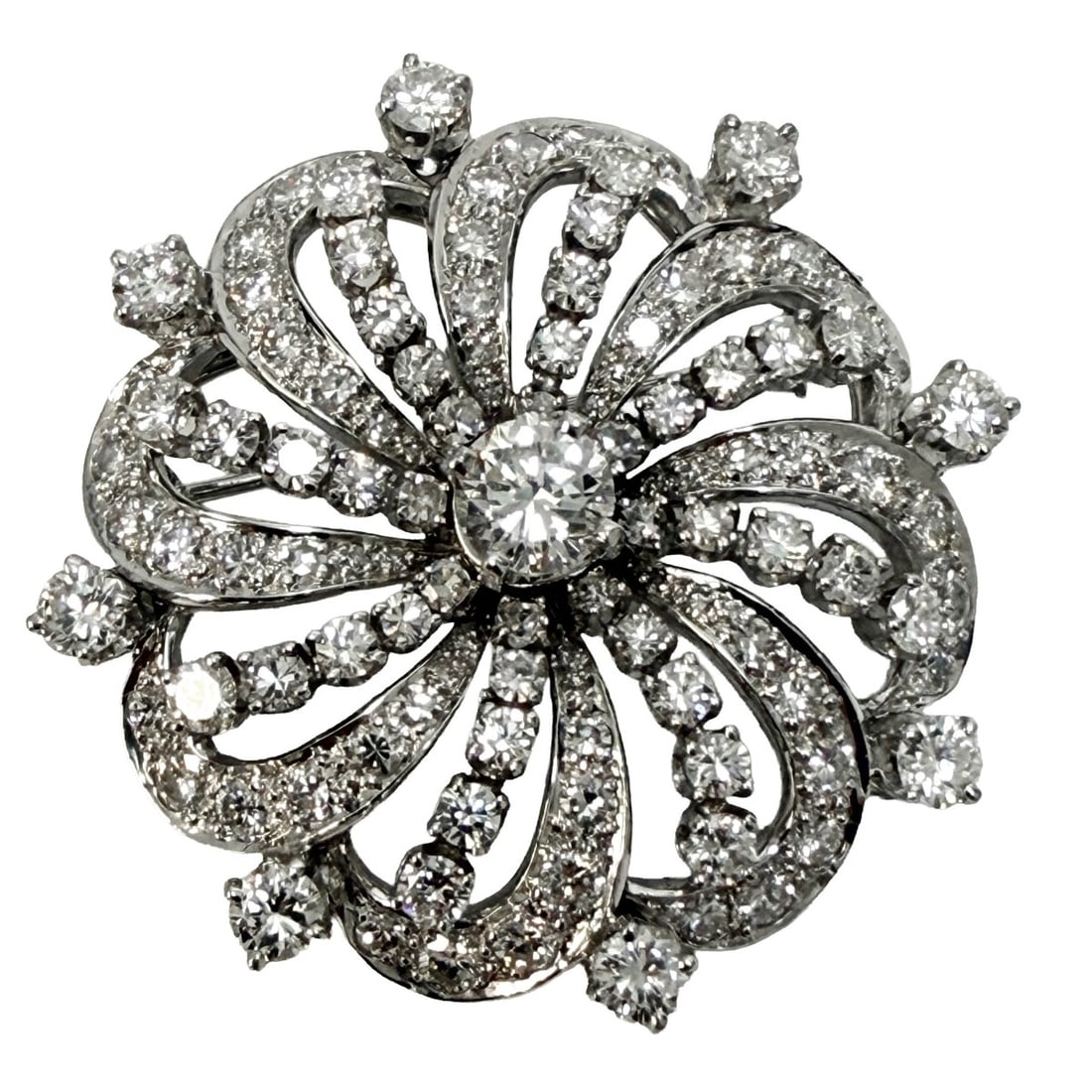 Diamond Circular Brooch: Lady's Platinum Vintage Diamond Circular Brooch Set in the Center with a Round Brilliant Cut Diamond Measuring 5.8mm, Weighing approx. .75 cts. G-H-VS2 Clarity and is Accented Throughout with 112