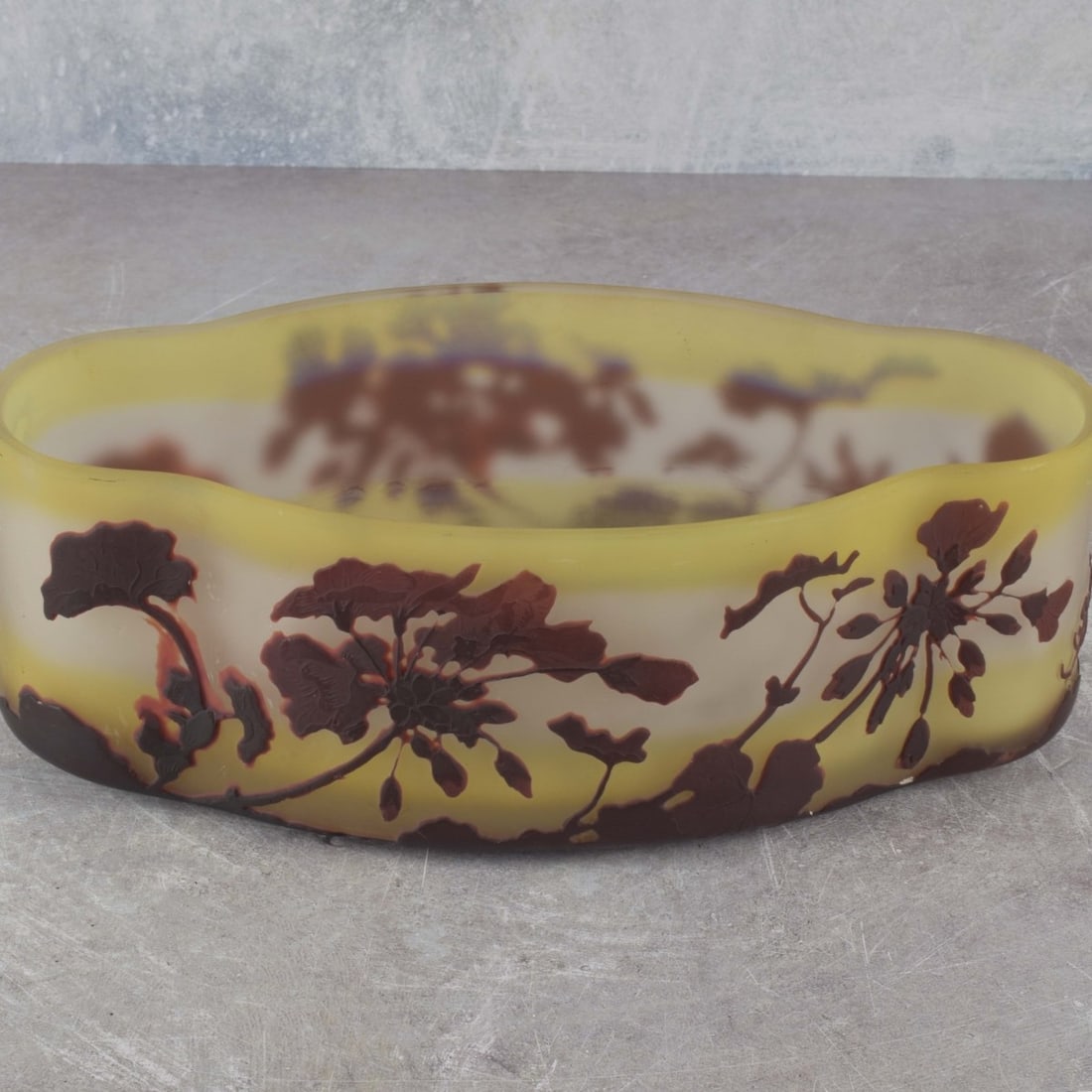 Galle Cameo Glass Bowl: Emile Galle French Cameo Glass Bowl in an Ovoid and Lobe Form Depicting a Floral Motif Circa 1900. Signed "Galle" in cameo to the side. Measures: 3-1/4" high, 9-3/4" wide, 5-1/4" deep. Kodner