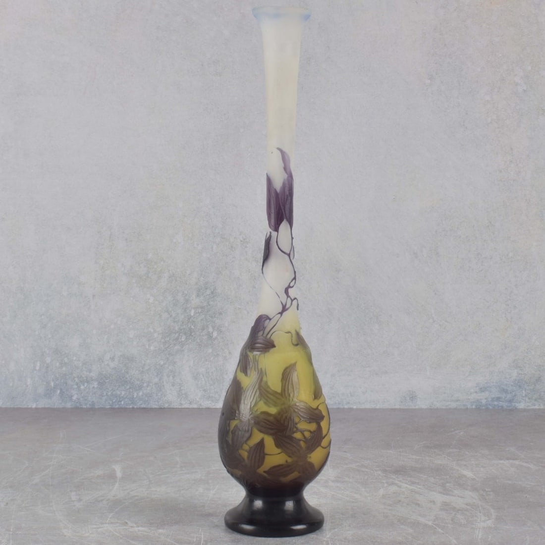 Galle Cameo Glass Vase: Emile Galle French Cameo Glass Solifore Long Neck Vase Depicting a Floral Motif Circa 1900. Signed "Galle" in cameo to the side. Measures: 12" high, 2-3/4" diameter. Kodner Galleries offers phone and