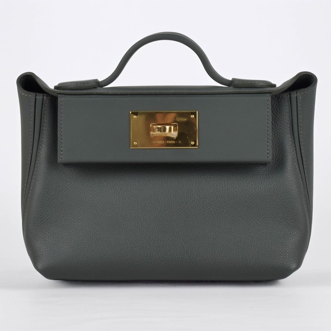 Hermes Handbag: Hermes-Paris Evercolor Swift 24/24 21 Vert Mangrove Handbag. New with box, papers and original invoice. Measures: 8" wide, 6" high, 4" deep. Kodner Galleries offers phone and absentee bidding at a