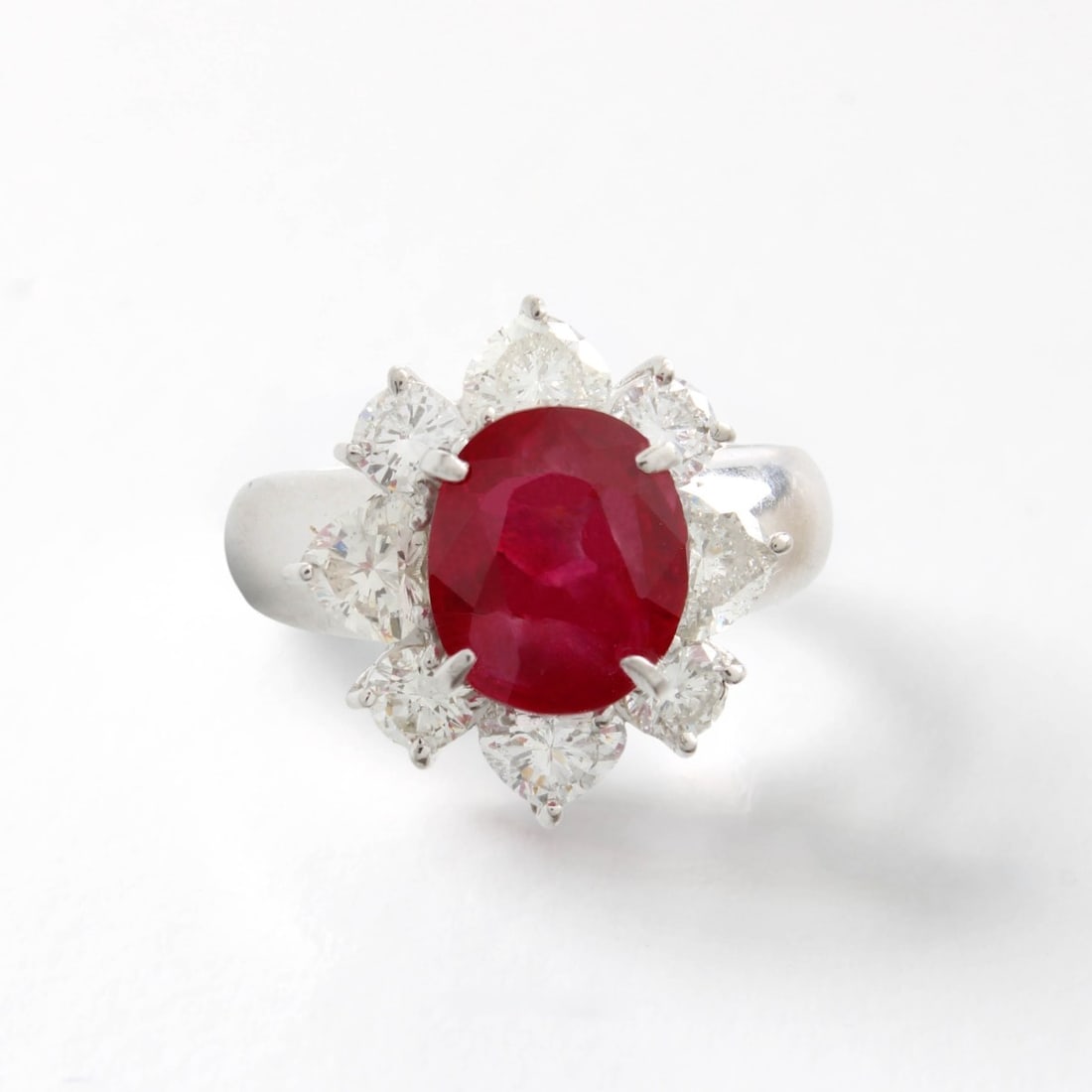 AGL Burma No Heat Ruby & Diamond Ring: AGL Certified 3.29 Carat Oval Cut Burma No Heat Ruby, Approx. 1.62 Carat TW Heart Shape and Round Brilliant Cut Diamond, Platinum and 18 Karat White Gold Ring. Ruby measures 9.17 x 7.83 x 5.11mm.