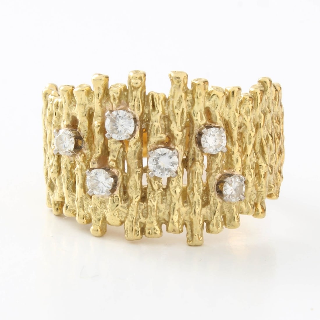 18K Band: Vintage Textured 18 Karat Yellow Gold Band Accented with Six Small Round Brilliant Cut Diamonds. Stamped 18K. Ring size 7-1/4. Approx. weight: 9.38 grams. Kodner Galleries offers phone and absentee