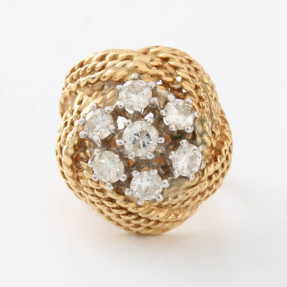 Diamond and 14K Ring: Vintage Approx. .75 Carat TW Seven Round Brilliant Cut Diamond and 14 Karat Yellow Gold Starburst Dome Ring. Diamonds H-I color, SI clarity. Ring size 3-1/2. Approx. weight: 8.05 grams. Kodner