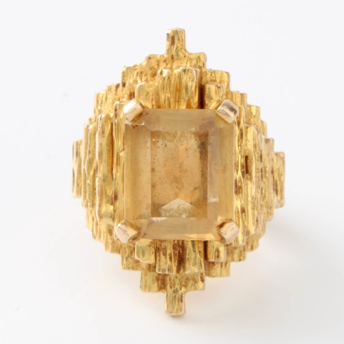 Citrine and 14K Ring: Retro Modern Design Rectangular Cut Citrine and Textured 14 Karat Yellow Gold Ring. Ring size 3. Approx. weight: 18.39 grams. Kodner Galleries offers phone and absentee bidding at a low, flat 21%