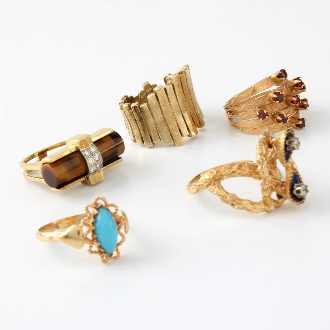 Vintage Gold Rings: Collection of Five (5) Vintage Yellow Gold Rings. To include three (3) stamped 14K and two (2) stamped 18K. Variously set with turquoise, tiger eye, ruby and diamond. Approx. total weight: 14.67 grams