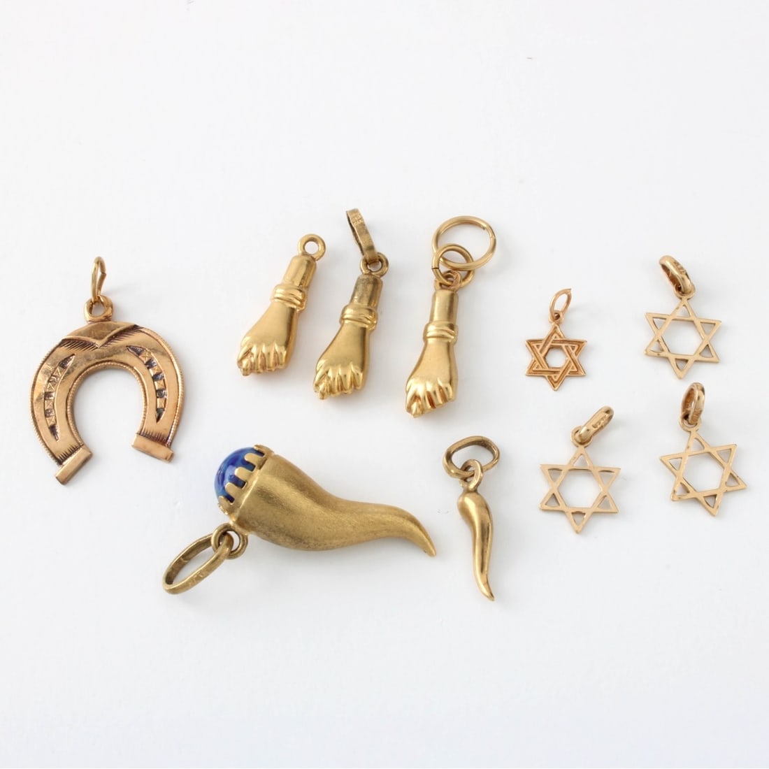 14K Gold Pendants and Charms: Collection of Eighteen (18) Small 14 Karat Yellow Gold Miscellaneous. Pendants and Charms. All stamped 14K. Approx. total weight: 8.34 grams. Kodner Galleries offers phone and absentee bidding at a