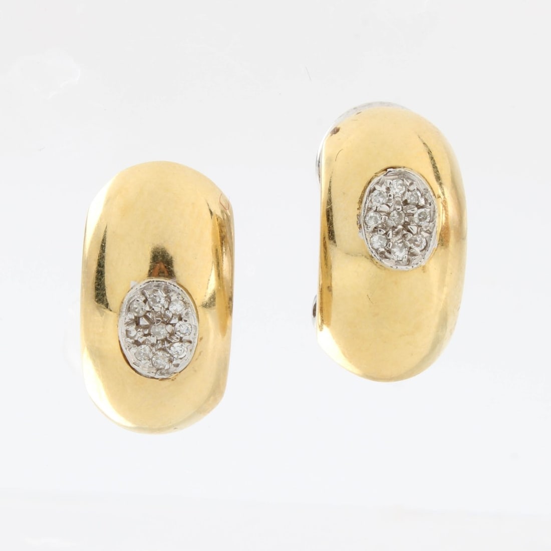 18K and Diamond Earrings: Vintage Delicate 18 Karat Yellow Gold Clip Back Earrings Accented with Pave Set Small Round Cut Diamonds. Measure 5/8" x 3/8". Approx. total weight: 5.76 grams. Kodner Galleries offers phone and