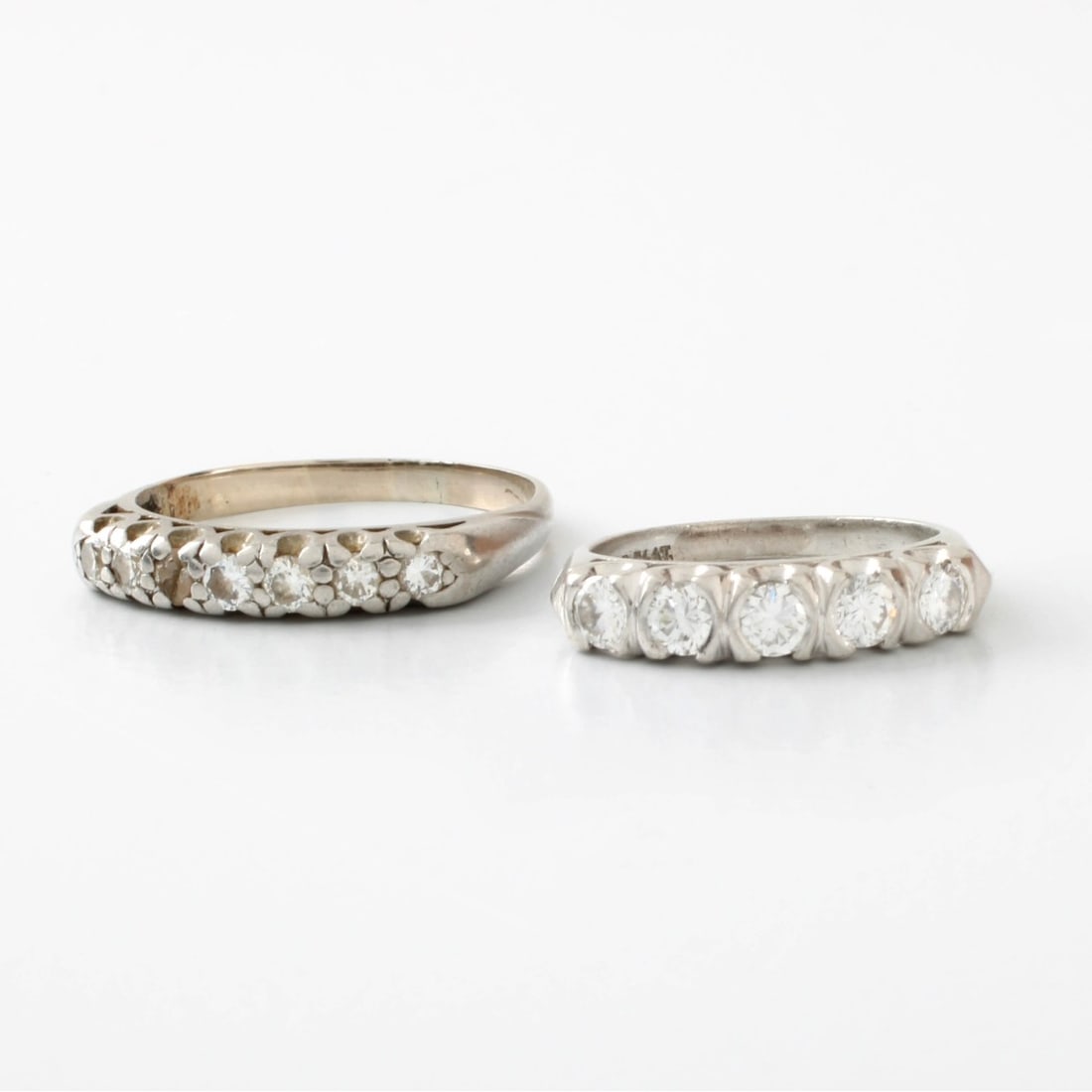 Deco Diamond and Platinum Bands: Art Deco Diamond and Platinum Bands / Rings. Each set small round cut diamonds. Ring sizes 4-3/4 and 9. Approx. total weight: 9.53 grams. Kodner Galleries offers phone and absentee bidding at a low,