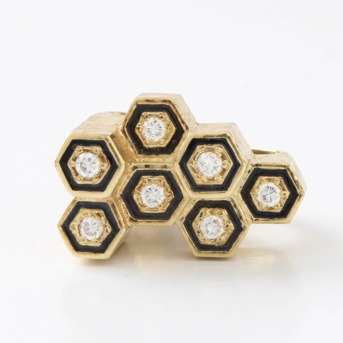 Diamond and 14K Ring: Retro Modern Design approx. .35 Carat TW Seven Round Brilliant Cut Diamond and 14 Karat Yellow Gold Ring. Diamonds G-H color, VS clarity. Ring size 3. Approx. weight: 11.08 grams. Kodner Galleries