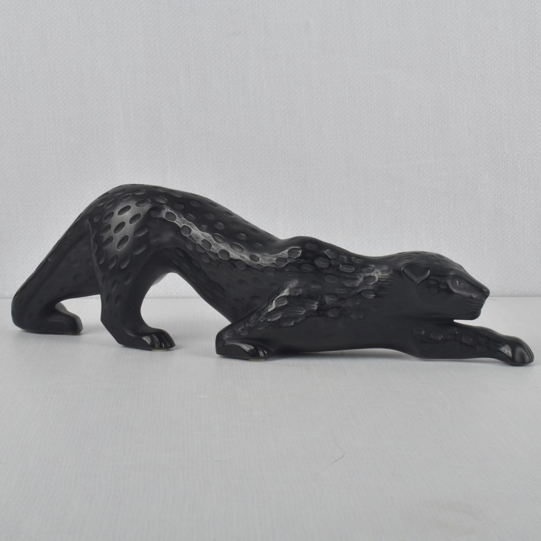 Lalique France "Zeila" Sculpture: Lalique France Crystal "Zeila" Panther Sculpture in Black Glass. Signed Lalique France to the bottom of a front paw. Measures: 4-1/4" H, 14-1/2" L, 2-1/2" W. Kodner Galleries offers phone and