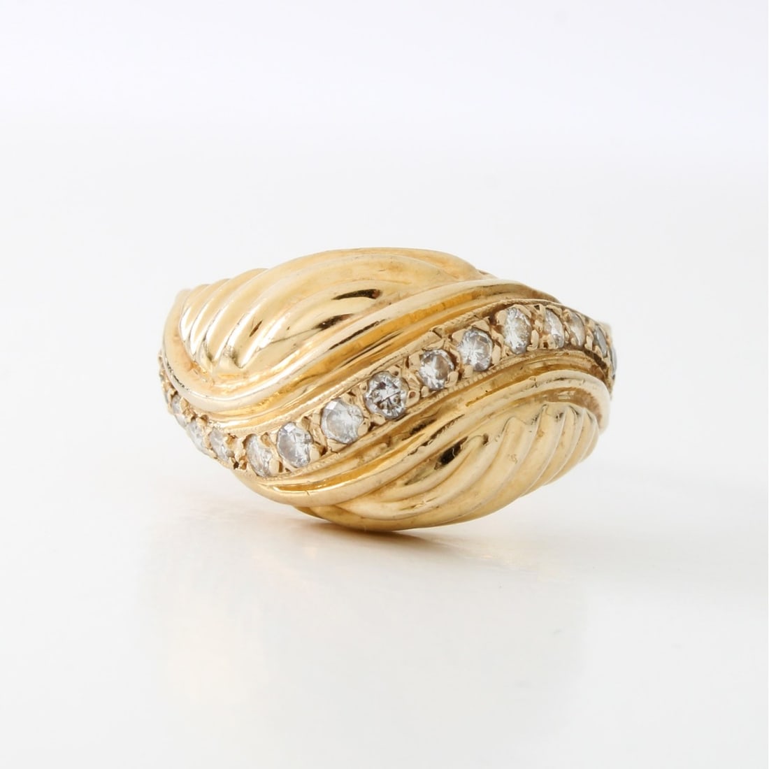 Diamond and 14K Ring: Vintage Approx. .60 Carat TW Round Brilliant Cut Diamond and 14 Karat Yellow Gold Dome Ring. Diamonds F color, VS1 clarity. Stamped 14K. Ring size 5-3/4. Approx. weight: 4.60 grams. Kodner Galleries o