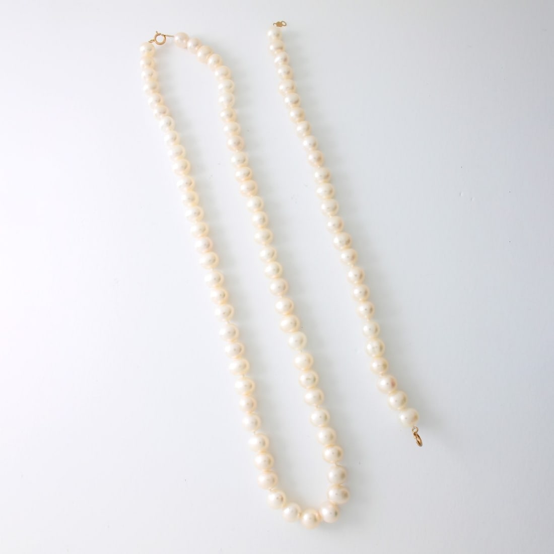Pearl and 14K Necklace and Bracelet: Vintage 7.0-8.5mm Baroque Pearl and 14 Karat Yellow Gold Bracelet and Bracelet. Pearls with good luster and polish. Clasps stamped 585. Necklace measures 18" L; bracelet measures 7-1/4" L. Approx.